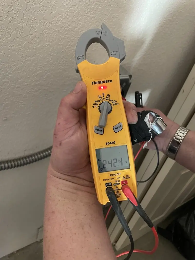Voltage testing with clamp meter during Whole House Surge Protector in Mulberry